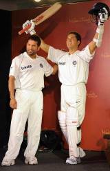 Sachin Tendulkar stands next to a wax figure of himself set to feature at Madame Tussauds in London.